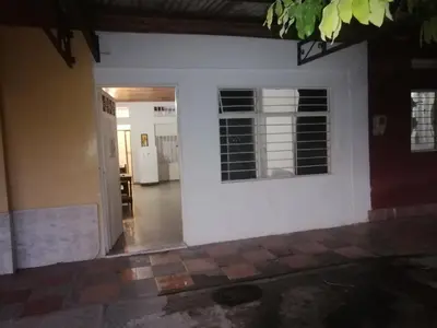 a white wall with a window and a hallway at Casa de relajación low cost in La Dorada