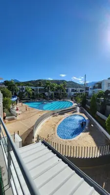 a view of a swimming pool at a resort at Apartasol Club Ciudadela Santa Fe - Santa Fe de Antioquia in Santa Fe de Antioquia