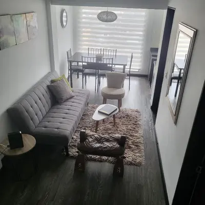 a living room with a couch and a table at LA CASA DEL CABLE -Comodo Apartamento 102- in Manizales