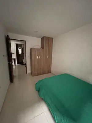 a bedroom with a green bed in a room at no Reservar in Bello