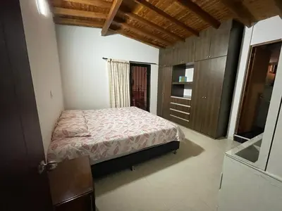 a bedroom with a bed and a dresser in it at no Reservar in Bello