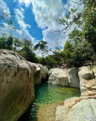 a pool of water between two large rocks at Apartamento Balcón 201 in San Luis