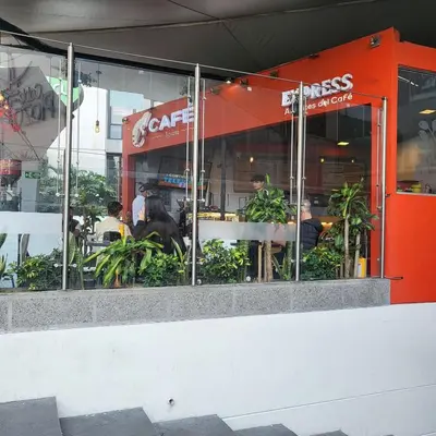 a restaurant with people sitting at tables in the window at LA CASA DEL CABLE - Hermoso Apartamento - in Manizales