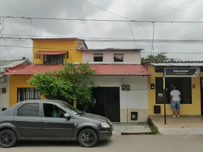 a silver car parked in front of a building at Casa low cost in La Dorada