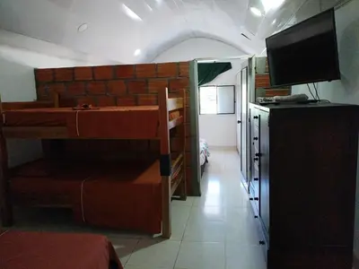 a small room with a kitchen and a room with a kitchen gmaxwell gmaxwell gmaxwell gmaxwell at Casa de relajación low cost in La Dorada
