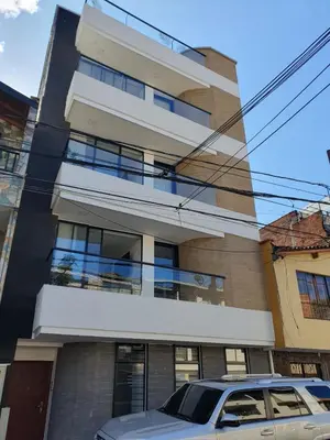a building with a car parked in front of it at Medellin-Cerca al Poblado-201 in Medellín