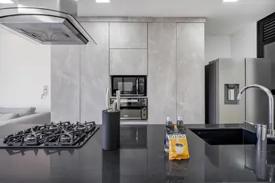 a kitchen with a stove and a stove top oven at MEDELLIN- Cerca al Poblado - 301 in Medellín