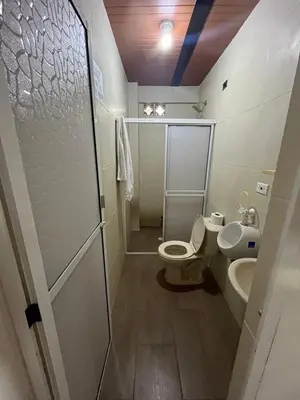 a bathroom with a toilet and a sink at Las 5 Quintas - Acogedora casa in San Rafael