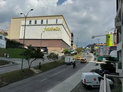 a view of a street with a building and cars at BALMORAL in Manizales