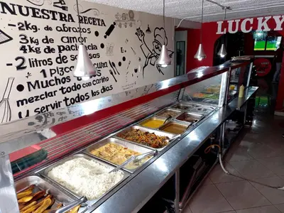 a buffet line with many different types of food at Hotel boutique San Pablo H10 in Medellín