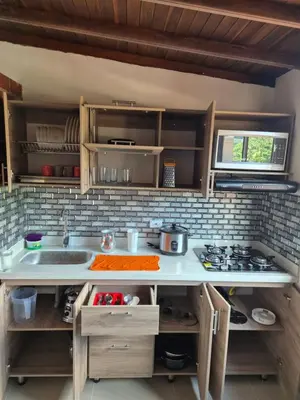 a kitchen with a sink and a counter top at EXCLUSIVO y ELEGANTE APARTAMENTO in Medellín