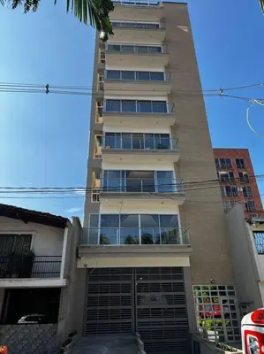 a tall apartment building with a large window at Mirador del Laureles, AC, Piscina, Parqueadero 701 in Medellín