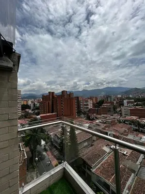 a view of a city from the balcony of a building at Lindo apartamento en Laureles con piscina 501 in Medellín