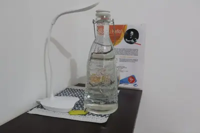a bottle of water sitting on top of a table at Living Poblado Manila 3029 Habitación Doble con Baño Privado in Medellín