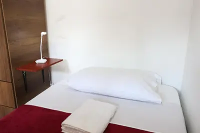 a white bed with two towels on it in a room at Living Poblado Manila 301 D Habitación Doble in Medellín