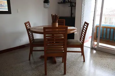a dining room table with four chairs and a table and a table and chairsktop at Living Poblado Manila 301 F Habitación Individual in Medellín