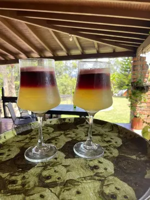 two wine glasses sitting on top of a table at Encanto Verde in Rionegro