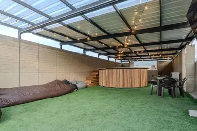 a large room with a large couch and a table at Apartamento en Laureles 2BR con rooftop y piscina 702 in Medellín