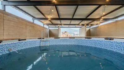 a large swimming pool in a building at Apartamento en laureles con piscina, parqueadero 302 in Medellín