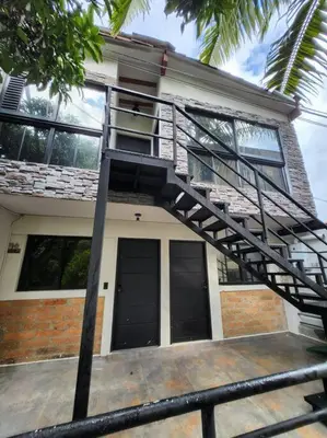 a house with a spiral staircase in front of it at Acogedor apartaloft El Poblado in Medellín