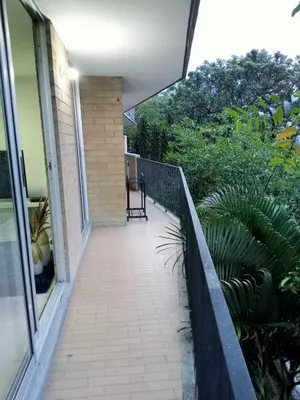 a balcony of a house with a chair on it at Apartment in Poblado - Medellín in Medellín