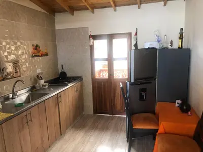 a kitchen with a sink and a refrigerator at habitacion amoblada in Sonsón