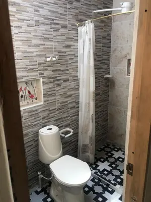 a bathroom with a toilet and a shower at habitacion amoblada in Sonsón