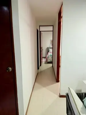 a hallway leading to a bedroom in a house at Apartment in Palmas - Poblado in Medellín