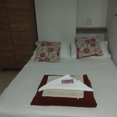 a hotel room with a towel on a bed at ApartaLoft 13, NevadaLofts Sabaneta in Sabaneta