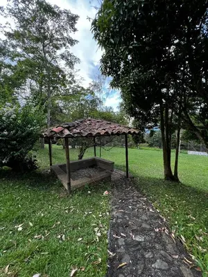 a small structure in the grass in a park at Yarumito Finca Hotel Cabaña Narciso in Barbosa