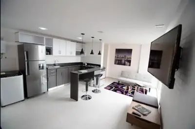 a kitchen with a refrigerator and a counter top at Espacio Ideal En Pausa in Medellín