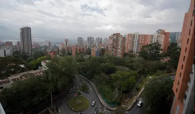 an aerial view of a city with tall buildings at Espacio Ideal En Pausa in Medellín