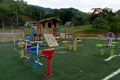 a playground with colorful play equipment in a field at Santa María del Río in San Rafael