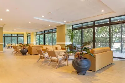 a lobby with couches and chairs and a plant at Luxury Escape by El Tesoro Perfect Location 302 in Medellín