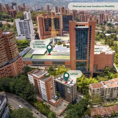 an aerial view of a city with tall buildings at Elegant Stay Steps from El Tesoro Mall 304 in Medellín