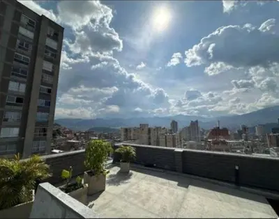 a view of a city skyline from a balcony at Hermoso Loft in Medellín