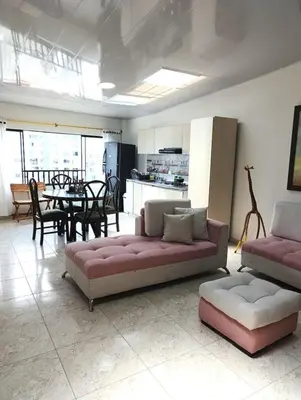 a living room with two couches and a dining room at Agradable y comodo apartamento en Manizales, barrio Chipre in Manizales