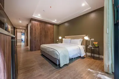 a bedroom with a large bed and a hallway at DUP 315 Tesoro - Cls in Medellín