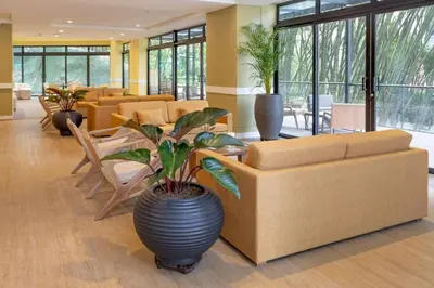 a lobby with a couch and a table and chairs at DUP 315 Tesoro - Cls in Medellín