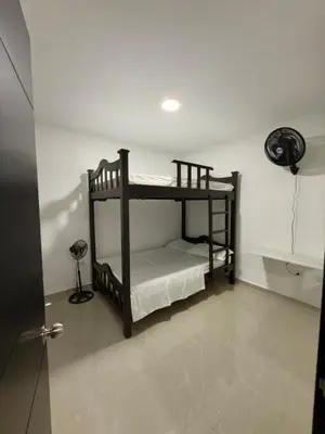a room with two bunk beds in a room at Estrena confortable casa in Mariquita
