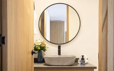 a bathroom with a sink and a mirror at Cozy Stadio Escape Rosa Negra Stay in Medellín