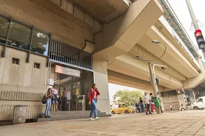 a group of people standing outside of a building at Cozy Stadio Escape Rosa Negra Stay in Medellín
