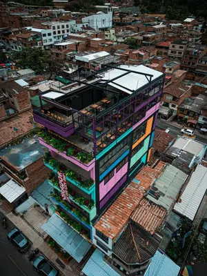 an overhead view of a building in a city at vive la experiencia comuna 13 Medellín INT 304 in Medellín