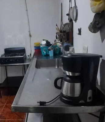 a coffee maker sitting on top of a kitchen counter at Casa de pesca in Honda