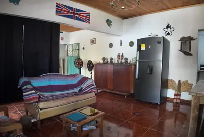 a living room with a refrigerator and a couch at Mirador del Río in Honda