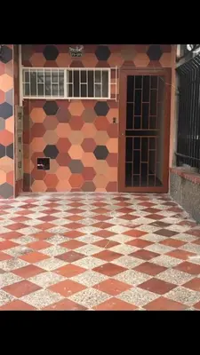 a building with a tiled floor and a door at Glen de 3 alcobas los molinos in Medellín