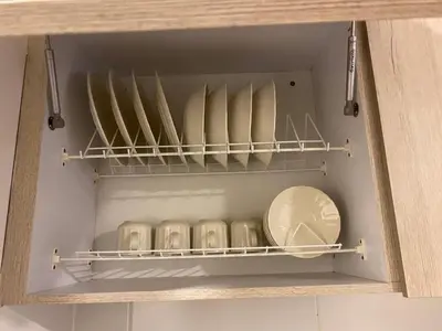 a drawer of a cupboard with plates and pans at Sector Turistico, Confort y Full Amoblado in Manizales