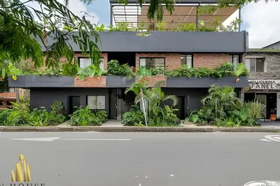 a building with plants on the side of it at Casa Solei 12-9 - Stylish Apt with Jacuzzi & AC in El Poblado