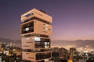 a tall building with a city in the background at Energy 601 - Prestigious Apt/Pool & Jacuzzi in El Poblado