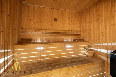 a sauna with wooden walls and a wooden tub at Morph 1001 - Exclusive apt in Poblado/BBQ in El Poblado